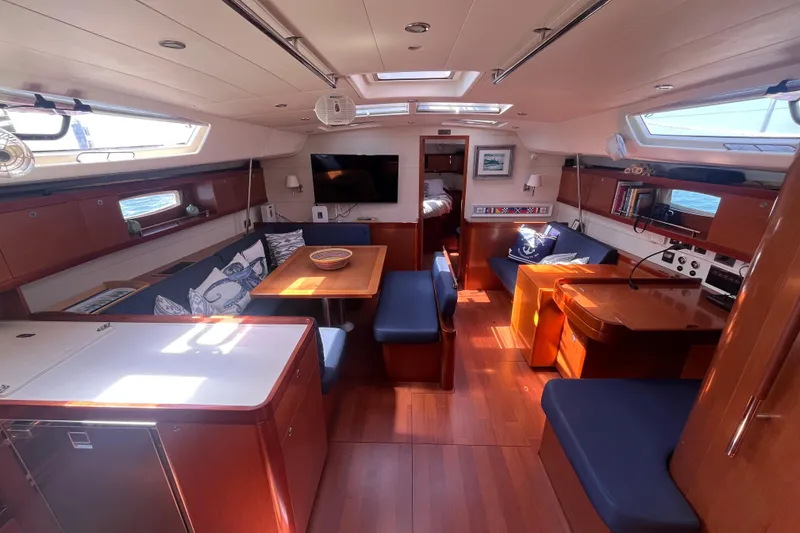 Slide: The Image of Interior of 2011 Beneteau Oceanis 54 yacht with elegant wood finish and modern amenities. - 23