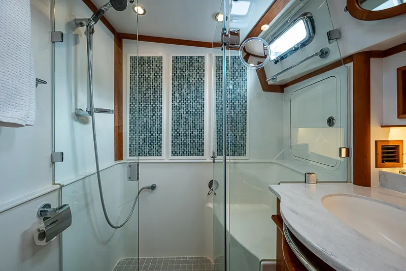 Slide: The Image of Luxurious bathroom in 2020 Sabre 48 Salon Express yacht with modern shower and elegant fixtures. - 18