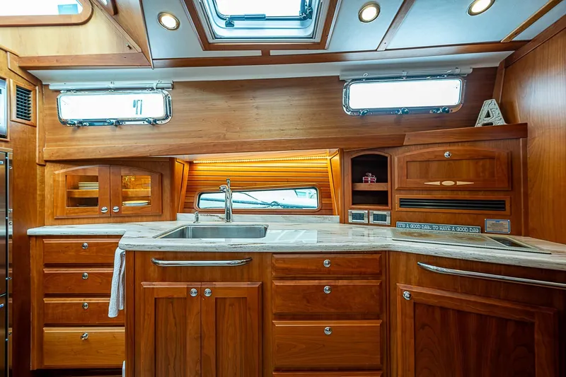 Slide: The Image of Luxurious wooden interior of 2020 Sabre 48 Salon Express yacht kitchen. - 12