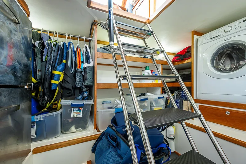 Slide: The Image of Laundry and storage area inside 2020 Sabre 48 Salon Express yacht. - 11