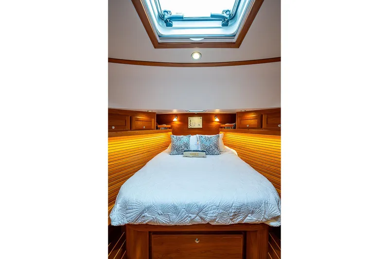 Slide: The Image of Luxurious cabin interior of 2020 Sabre 48 Salon Express yacht with skylight and cozy bedding. - 21
