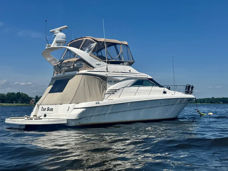 Slide: The Image of 2001 Sea Ray 400 Sedan Bridge on calm water. - 3
