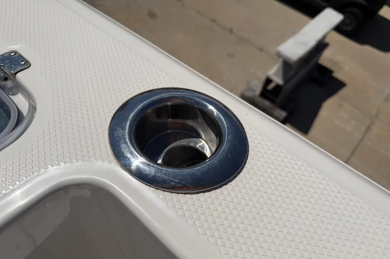 Slide: The Image of 2023 Robalo R360 Center Console boat detail with stainless steel cup holder. - 12