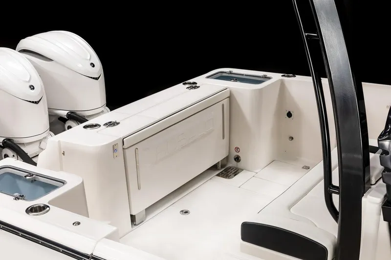 Slide: The Image of 2023 Robalo R360 Center Console boat interior with dual engines and seating area. - 52