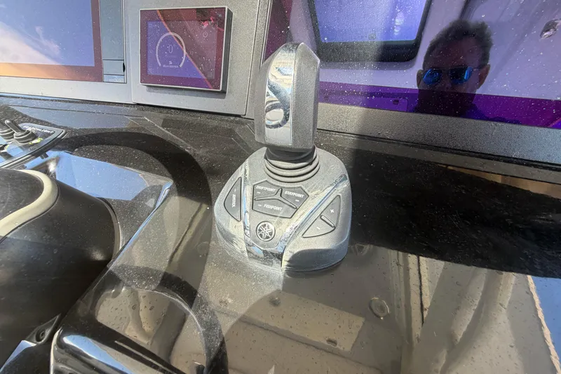 Slide: The Image of 2023 Robalo R360 Center Console boat dashboard with joystick control system. - 22