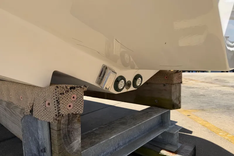 Slide: The Image of 2023 Robalo R360 Center Console boat hull on wooden support. - 45