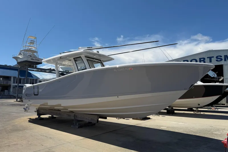 The Image of 2023 Robalo R360 Center Console boat displayed outdoors on a sunny day. - 0