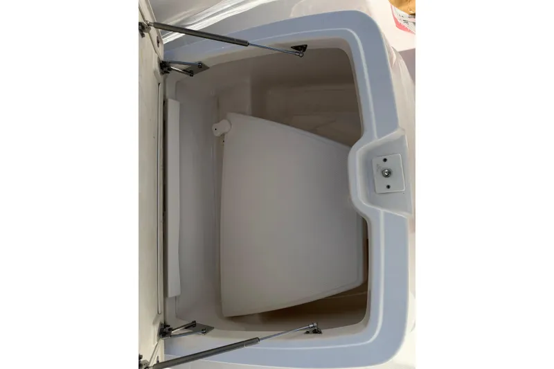 Slide: The Image of Storage compartment of 2023 Robalo R360 Center Console boat, open lid view. - 42