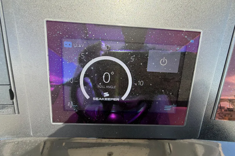 Slide: The Image of Display screen of 2023 Robalo R360 Center Console showing Seakeeper roll angle. - 19