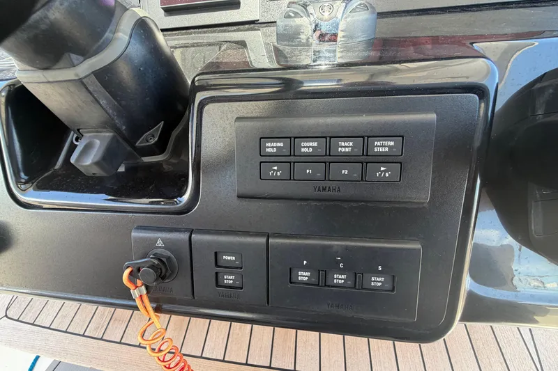 Slide: The Image of Control panel of a 2023 Robalo R360 Center Console boat with Yamaha controls. - 21