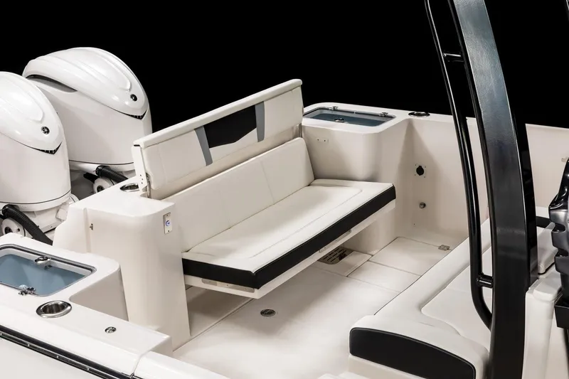 Slide: The Image of 2023 Robalo R360 Center Console boat interior with seating and dual engines. - 51