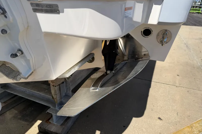 Slide: The Image of 2023 Robalo R360 Center Console boat stern detail with trim tab. - 5