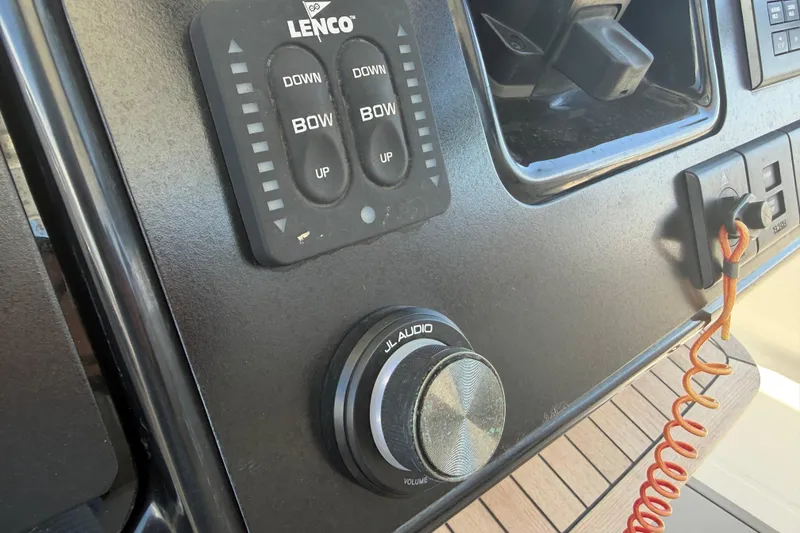 Slide: The Image of Control panel of 2023 Robalo R360 Center Console with Lenco and JL Audio features. - 31