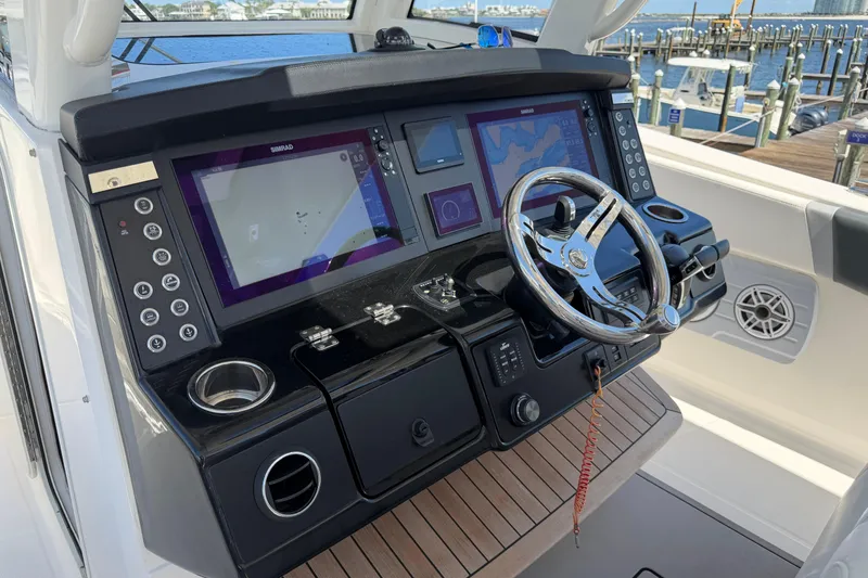 Slide: The Image of 2023 Robalo R360 Center Console helm with advanced navigation displays and controls. - 33