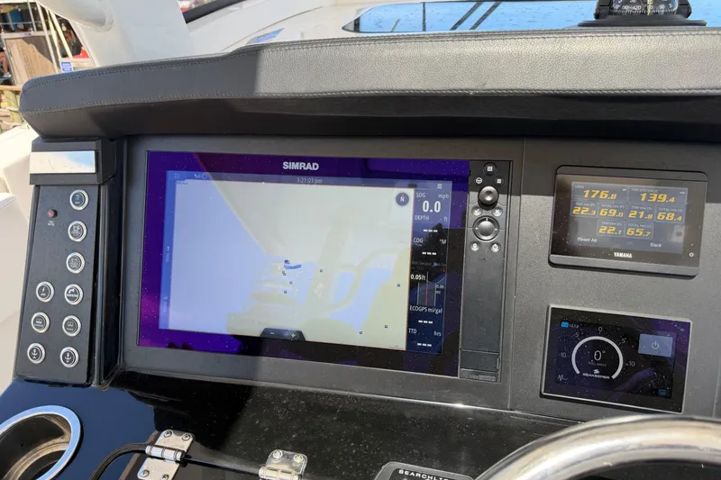 Slide: The Image of Dashboard of 2023 Robalo R360 Center Console with Simrad navigation display. - 29