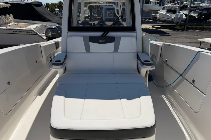 Slide: The Image of 2023 Robalo R360 Center Console boat interior with cushioned seating and cup holders. - 41