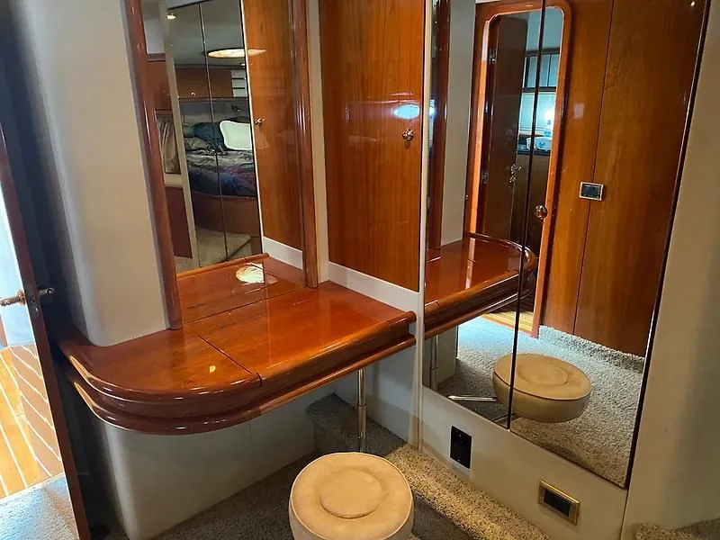 Slide: The Image of Interior of the 1998 Sunseeker Manhattan 62 with elegant wood finishes and mirrors. - 41