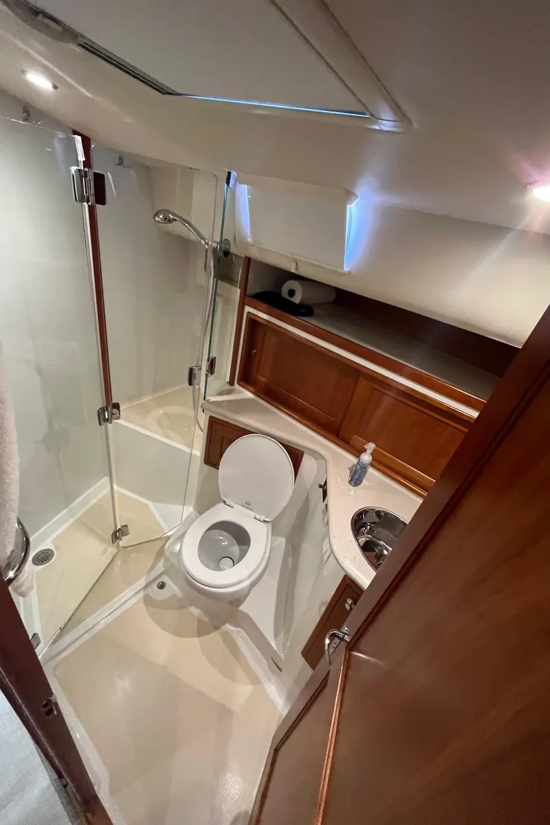 Slide: The Image of 2016 MJM 50z yacht bathroom with shower, toilet, and sink. - 31
