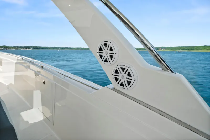 Slide: The Image of 2022 Tiara Yachts 38 LS boat with sleek design and dual speakers on deck. - 34