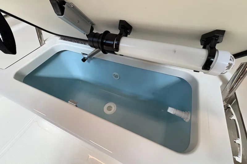 Slide: The Image of Livewell compartment in 2026 Boston Whaler 190 Montauk boat, featuring a clean, modern design. - 16