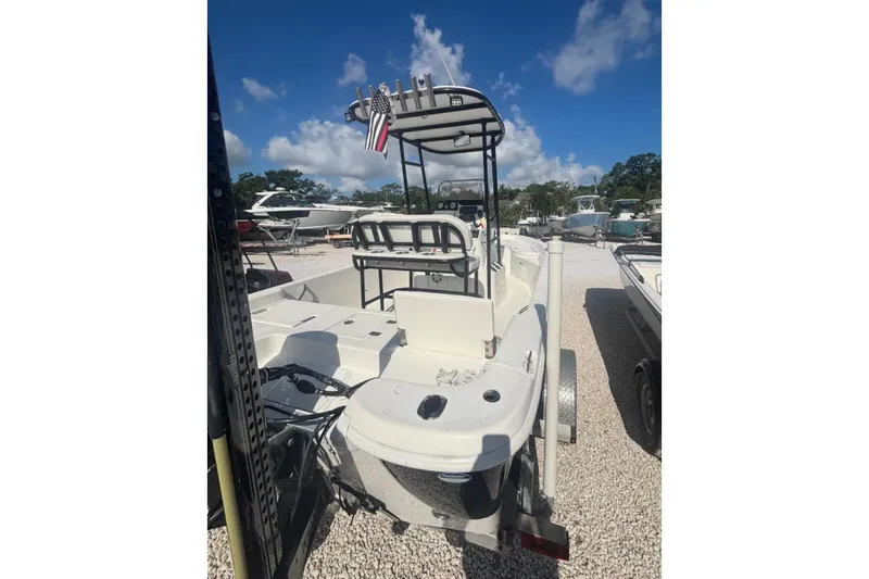 Slide: The Image of 2017 NauticStar 1910 NauticBay boat on trailer under clear blue sky. - 1