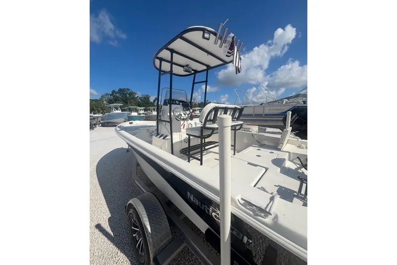 The Image of 2017 NauticStar 1910 NauticBay boat on trailer under clear blue sky. - 0