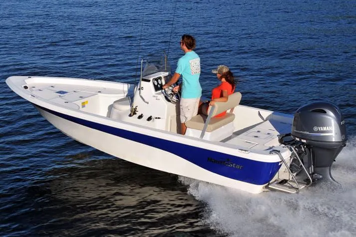 Slide: The Image of Manufacturer Provided Image: 2017 NauticStar 1910 NauticBay boat cruising on water with two passengers. - 7