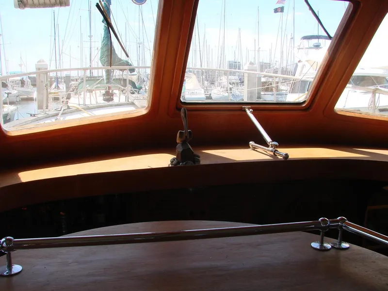 Slide: The Image of Interior view of a boat with large windows overlooking a marina. - 48