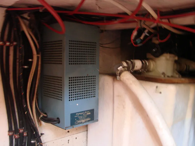 Slide: The Image of A technical space with cables and a blue device, likely an electrical system. - 31