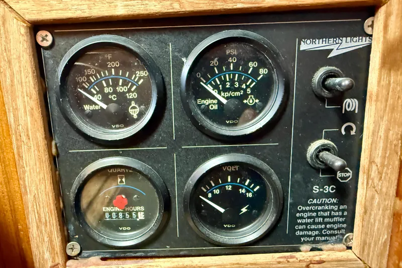 Slide: The Image of 1981 Kha Shing Sundeck ACMY engine panel with gauges and switches. - 11