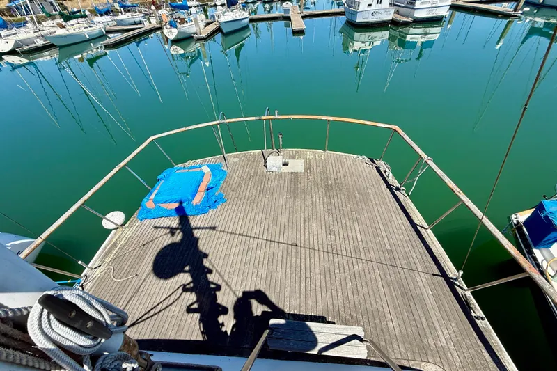 Slide: The Image of 1981 Kha Shing Sundeck ACMY yacht deck overlooking marina with moored boats. - 51