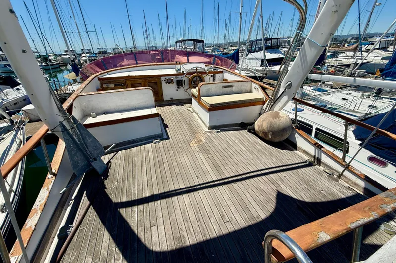 Slide: The Image of 1981 Kha Shing Sundeck ACMY yacht deck with wooden flooring, docked in a marina. - 50