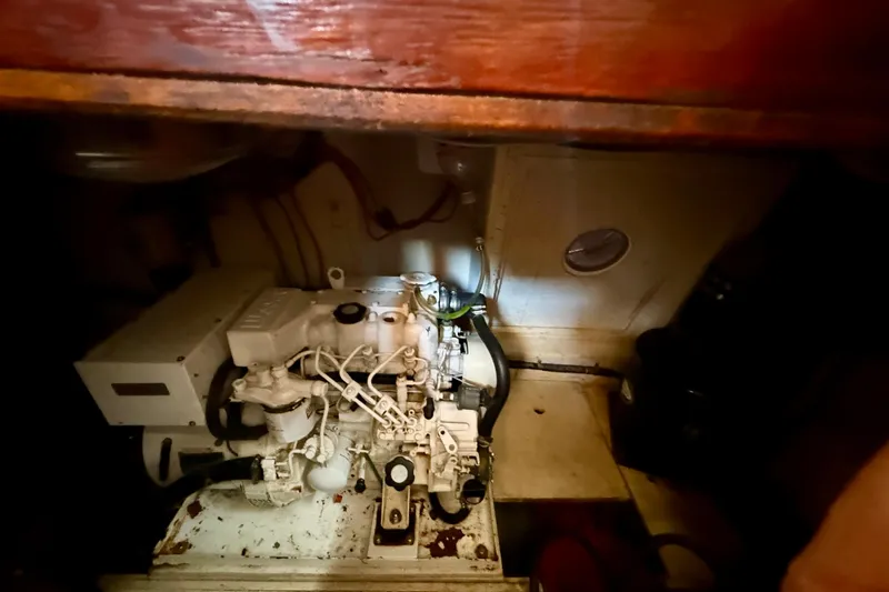 Slide: The Image of Engine room of 1981 Kha Shing Sundeck ACMY yacht, showcasing mechanical components. - 56