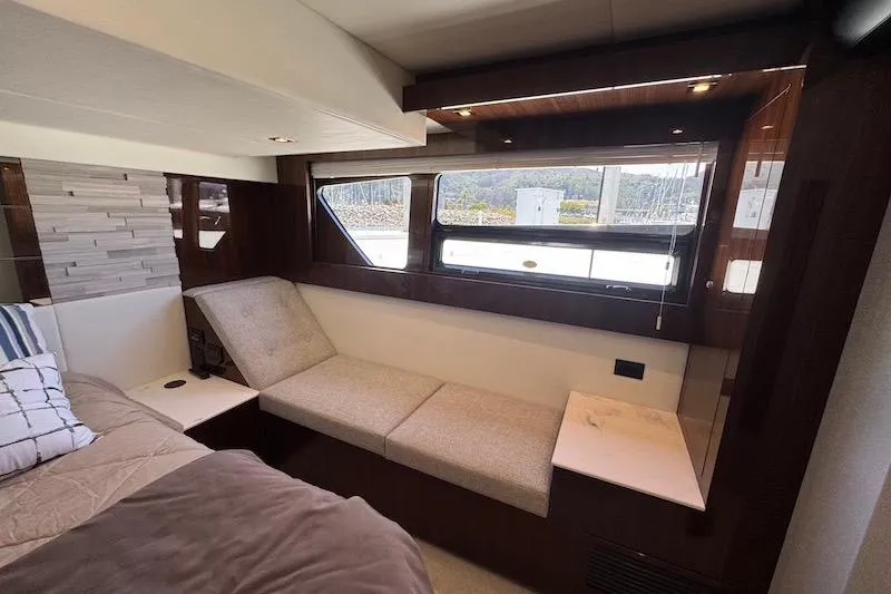 Slide: The Image of Luxurious interior of 2023 Cruisers Yachts 50 Cantius with elegant seating and large windows. - 54