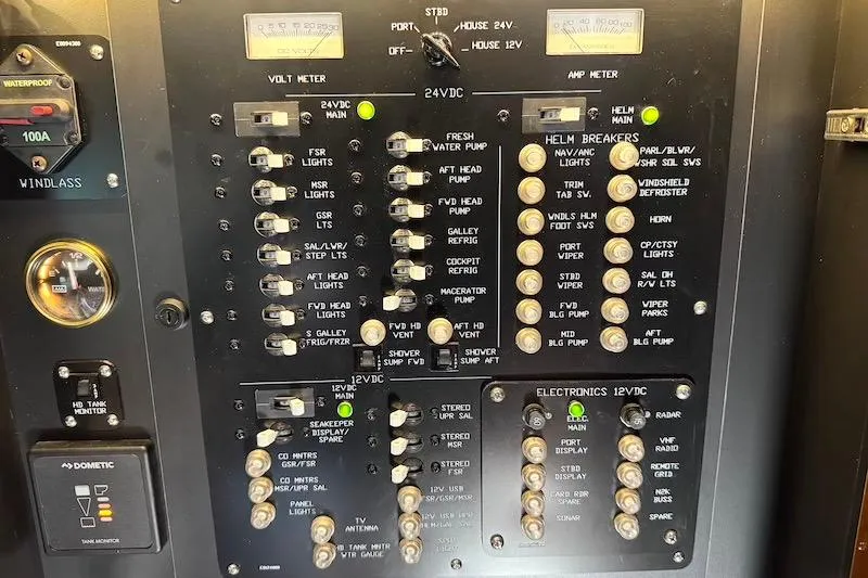 Slide: The Image of Electrical control panel on a 2023 Cruisers Yachts 50 Cantius boat. - 35