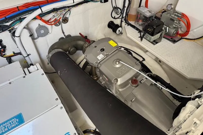 Slide: The Image of Engine room of 2023 Cruisers Yachts 50 Cantius, showcasing mechanical components and wiring. - 66