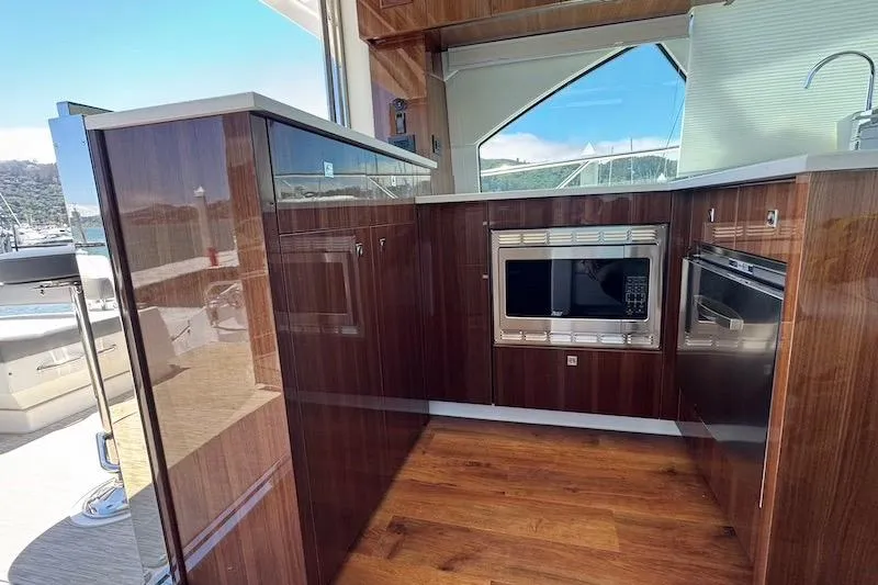 Slide: The Image of Luxurious kitchen interior of 2023 Cruisers Yachts 50 Cantius with modern appliances. - 19