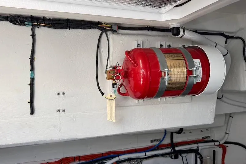 Slide: The Image of Fire extinguisher mounted in 2023 Cruisers Yachts 50 Cantius engine room. - 70