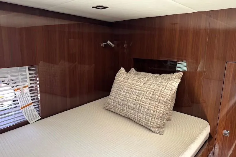 Slide: The Image of Luxurious cabin interior of 2023 Cruisers Yachts 50 Cantius with elegant wood paneling. - 37