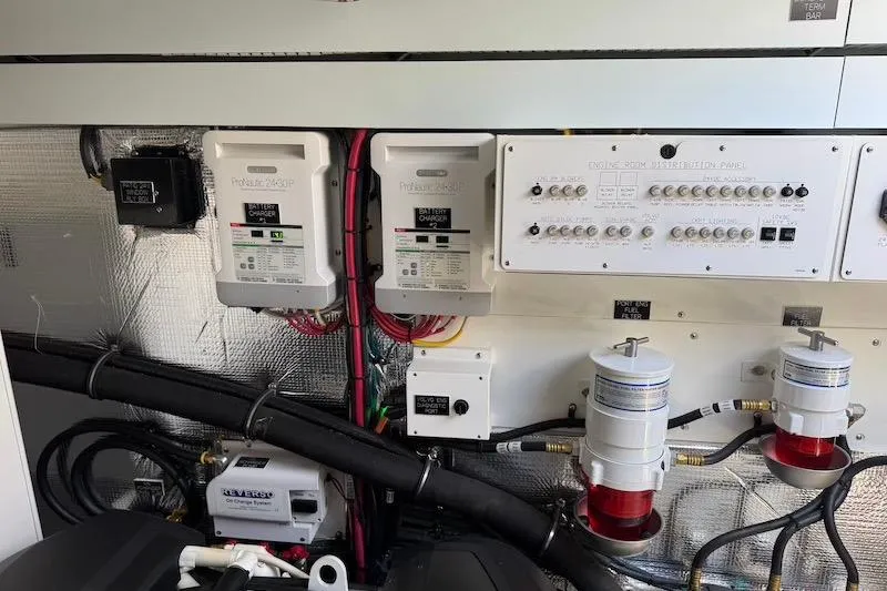 Slide: The Image of Electrical system of 2023 Cruisers Yachts 50 Cantius, featuring chargers and control panels. - 61