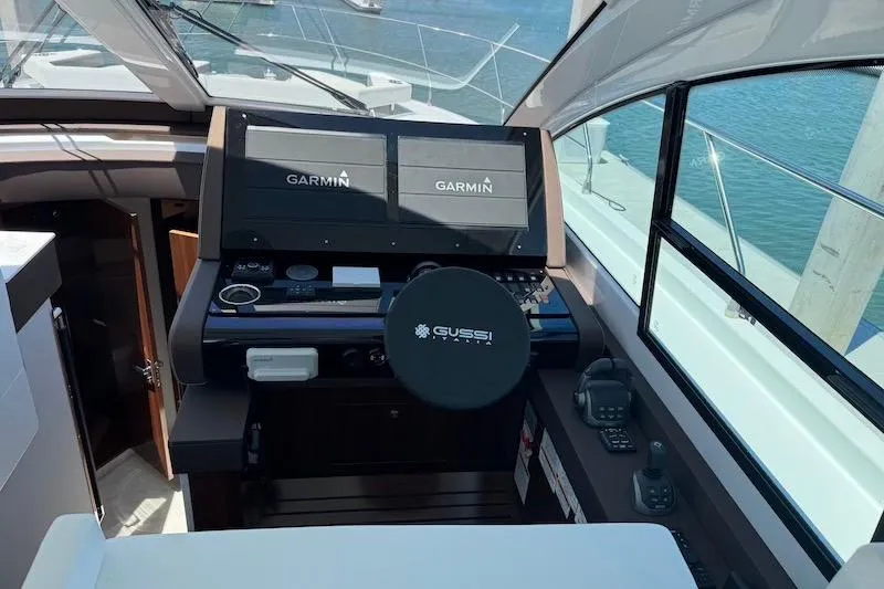 Slide: The Image of Helm of 2023 Cruisers Yachts 50 Cantius with Garmin navigation displays. - 26