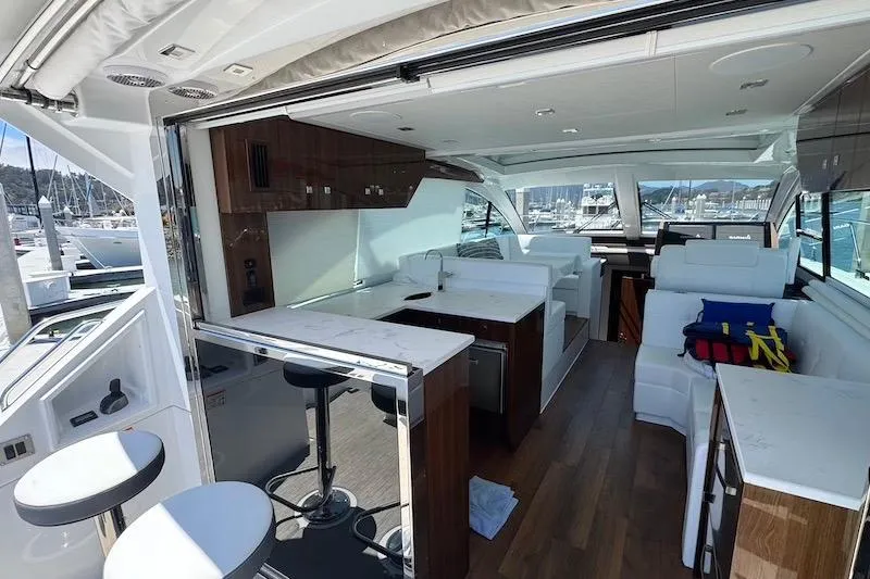 Slide: The Image of Luxurious interior of 2023 Cruisers Yachts 50 Cantius with modern kitchen and seating area. - 16