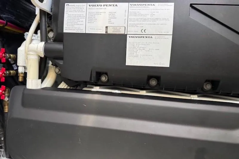 Slide: The Image of Engine compartment of 2023 Cruisers Yachts 50 Cantius with Volvo Penta components. - 63