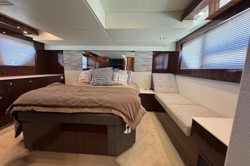 Slide: The Image of Luxurious bedroom interior of 2023 Cruisers Yachts 50 Cantius with modern design and cozy seating. - 53