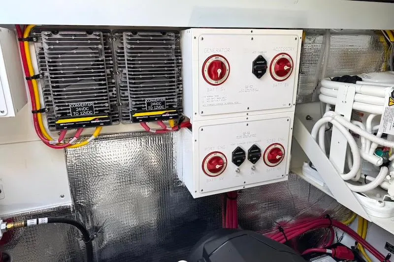 Slide: The Image of Electrical panel and converters in 2023 Cruisers Yachts 50 Cantius engine room. - 72