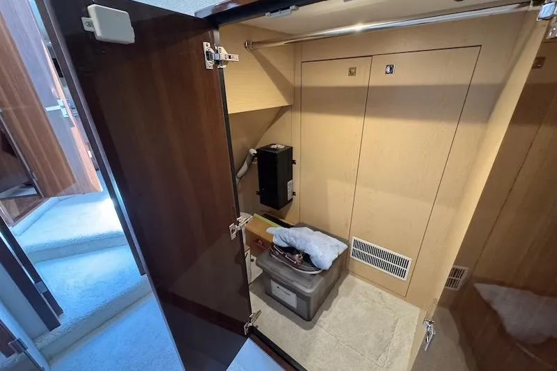 Slide: The Image of Storage area inside 2023 Cruisers Yachts 50 Cantius, featuring organized compartments and equipment. - 51