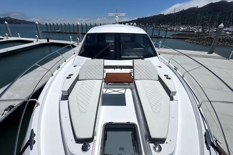 Slide: The Image of 2023 Cruisers Yachts 50 Cantius luxury yacht docked at marina. - 13