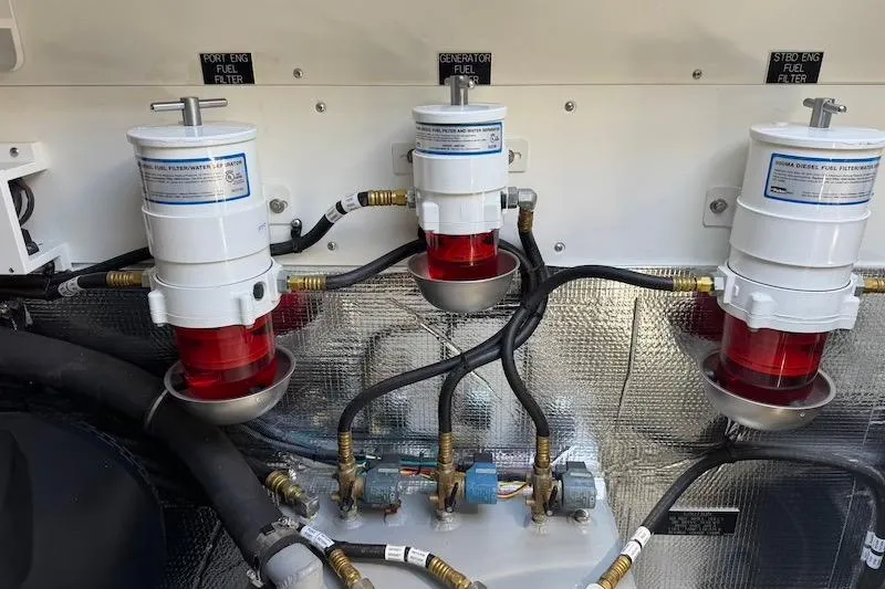 Slide: The Image of Fuel filters in the engine room of a 2023 Cruisers Yachts 50 Cantius. - 73