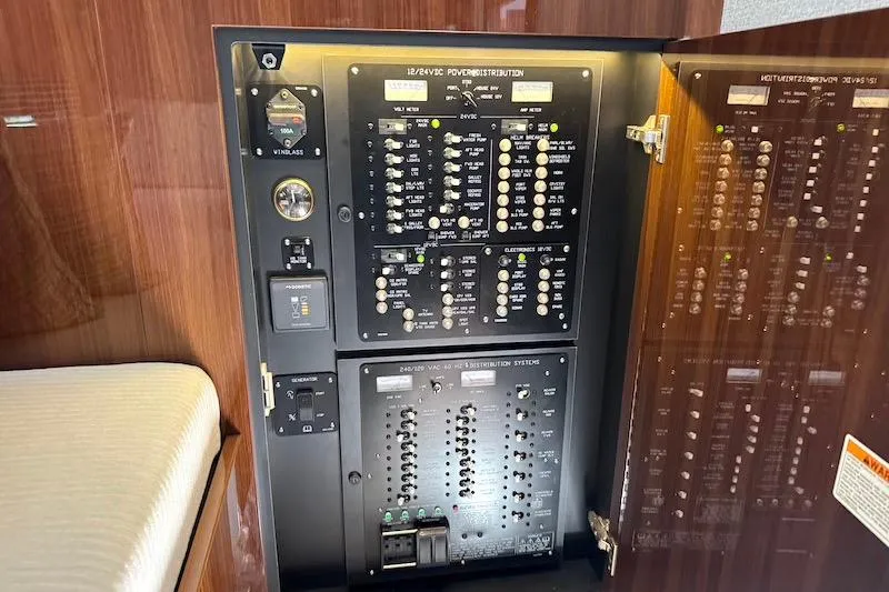 Slide: The Image of Electrical panel inside 2023 Cruisers Yachts 50 Cantius, showcasing power distribution system. - 34