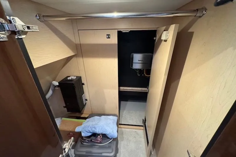 Slide: The Image of 2023 Cruisers Yachts 50 Cantius interior storage area with equipment and shelving. - 52